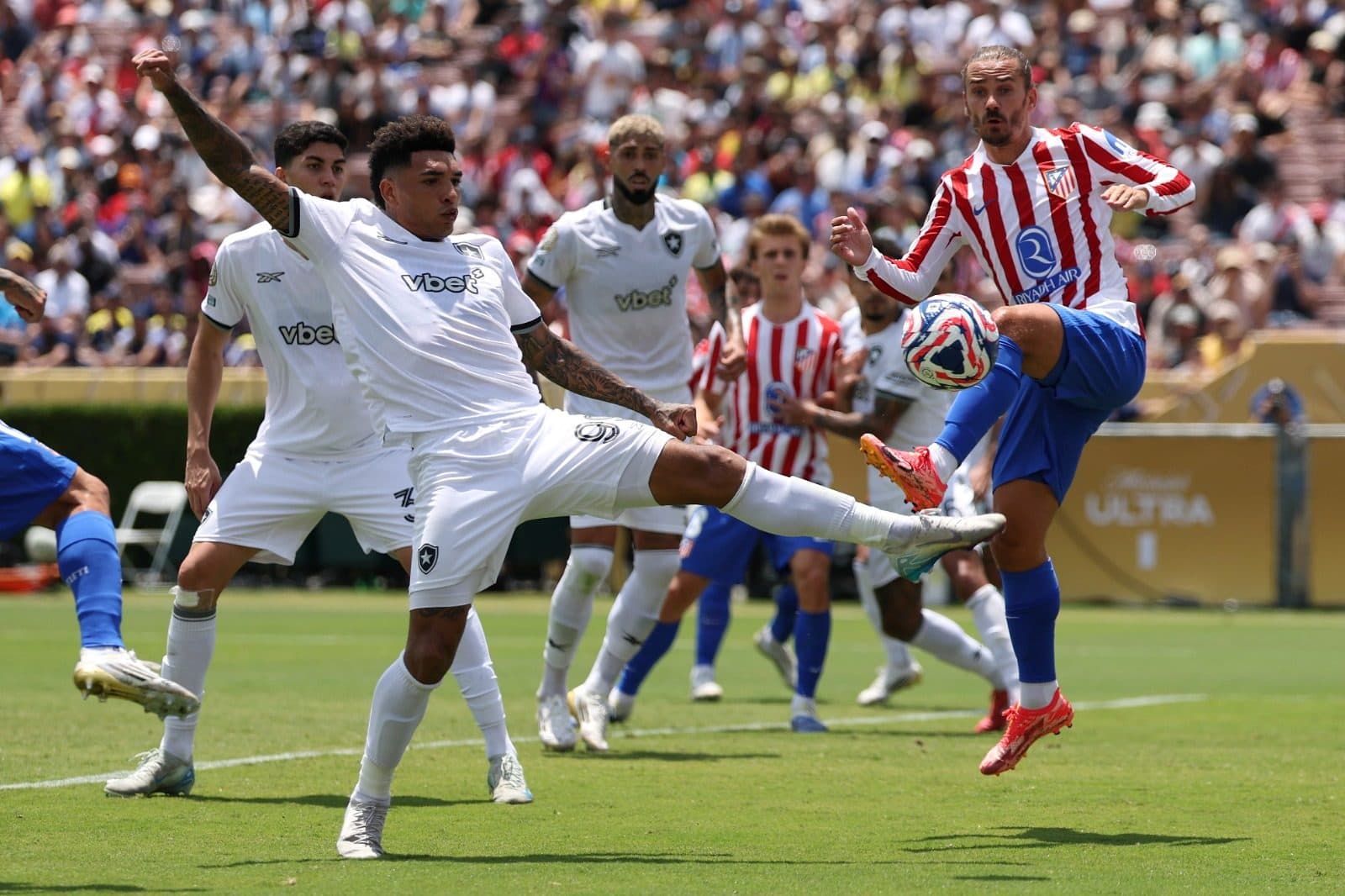 Igor Jesus #99 of Botafogo prevents a pass from Antoine Griezmann #7 of Atletico De Madrid during the FIFA Club World Cup 2025 group B match between Club Atletico de Madrid and Botafogo FR at Rose Bowl Stadium on June 23, 2025 in Pasadena, California.