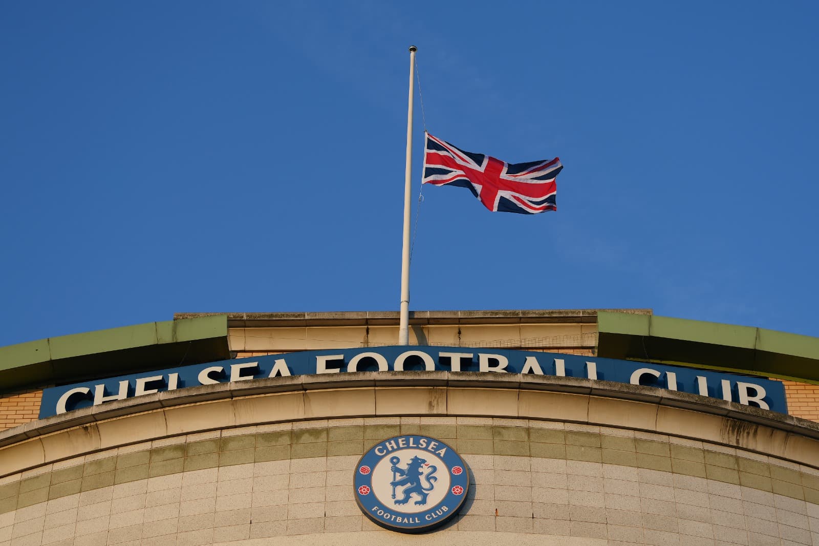 A Union Flag flag is flown at half mast outside the stadium as a tribute to Her Majesty Queen Elizabeth II, who died away at Balmoral Castle on September 8, 2022 prior to the UEFA Champions League group E match between Chelsea FC and FC Salzburg at Stamfo
