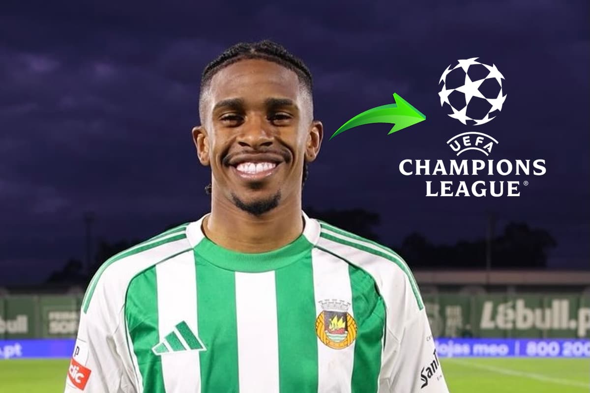 André Luiz sorrindo apó partida do Rio Ave ao lado da logo da Champions League e uma seta verde