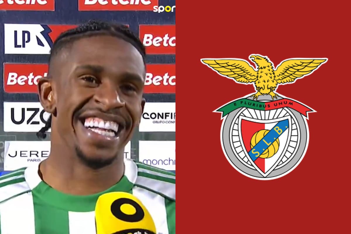 Montagem de André Luiz, do Rio Ave, sorrindo durante entrevista pós-jogo, ao lado do escudo do Benfica em fundo vermelho