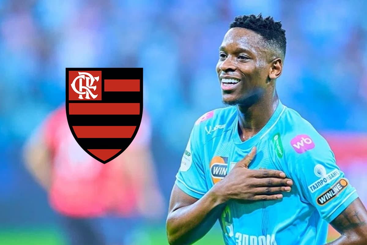 Luiz Henrique comemorando gol pelo Zenit ao lado do escudo do Flamengo